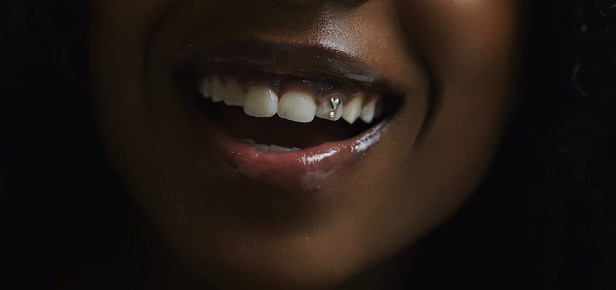 Are Tooth Gems Bad For Your Teeth? The Dangers Of This Sparkly Trend